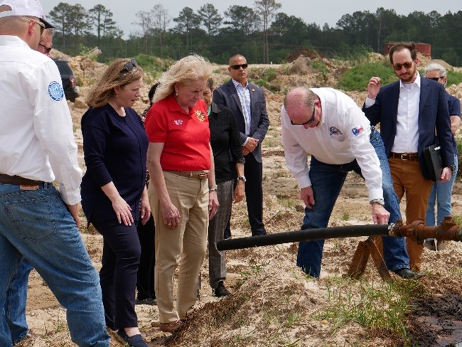 Clay Woodul, RRC Assistant Director of the Oil and Gas Division for Field Operations, shows Secretary Deb Haaland and members of Congress an orphaned well scheduled to be plugged in Houston